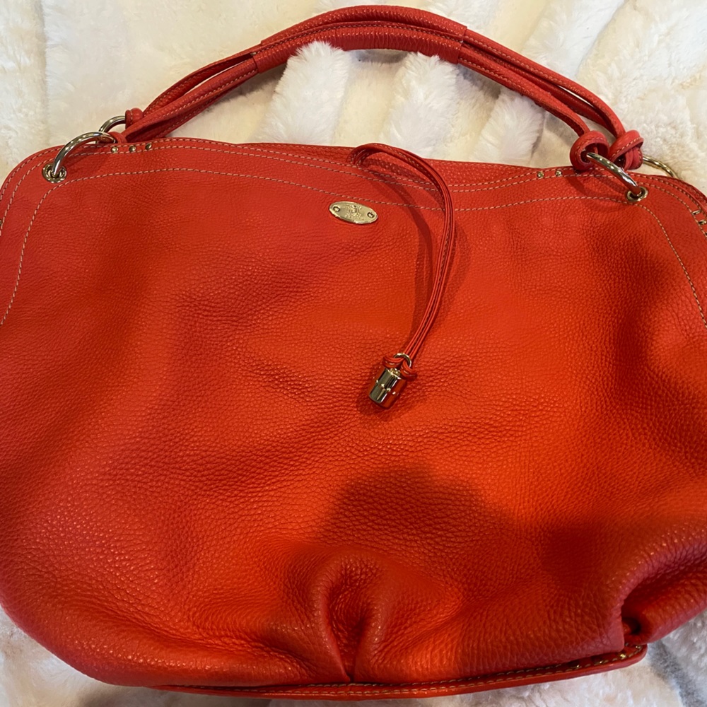 CELINE handbag NWOT 19x13x6” Beautiful leather. Roomy, Beautiful orange color!